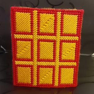 Crocheted tissue box cover.